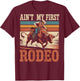 Toddler Bull Riding Aint My First Rodeo Cowboy Western Rider T-Shirt - T-Shirt | Maroon