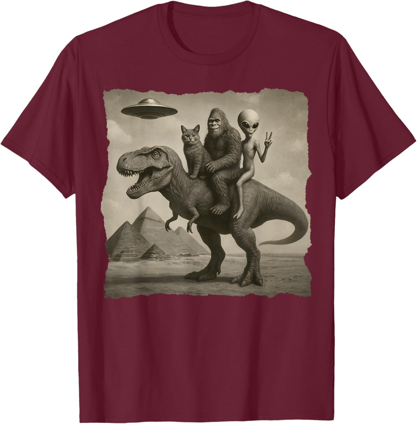 Cat with Alien and Bigfoot Riding a T-Rex at Giza Pyramids T-Shirt - T-Shirt | Maroon