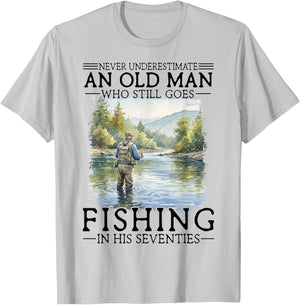 Never Underestimate an Old Man Who Goes Fishing in His 70s T-Shirt - T-Shirt | Ash