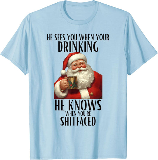HE SEES You When Your Drinking HE Knows Christmas Design T-Shirt - T-Shirt | Light Blue
