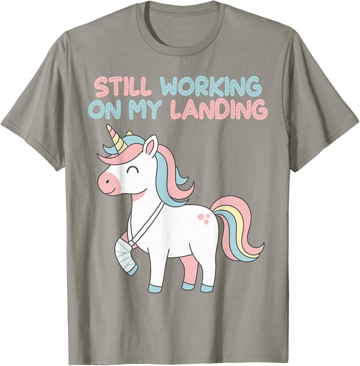 Still Working On My Landing Unicorn Funny Injury Broken T-Shirt - T-Shirt | Sand