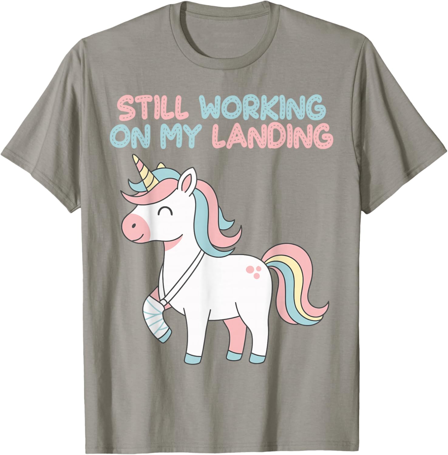 Still Working On My Landing Unicorn Funny Injury Broken T-Shirt - T-Shirt | Sand