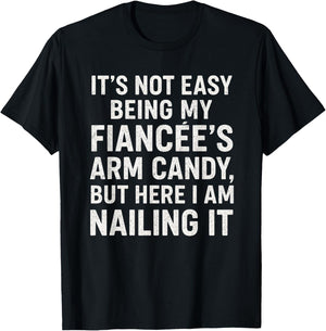 Funny Engagement It’s Not Easy Being My Fiancée’s Arm Candy T-Shirt - T-Shirt | Black