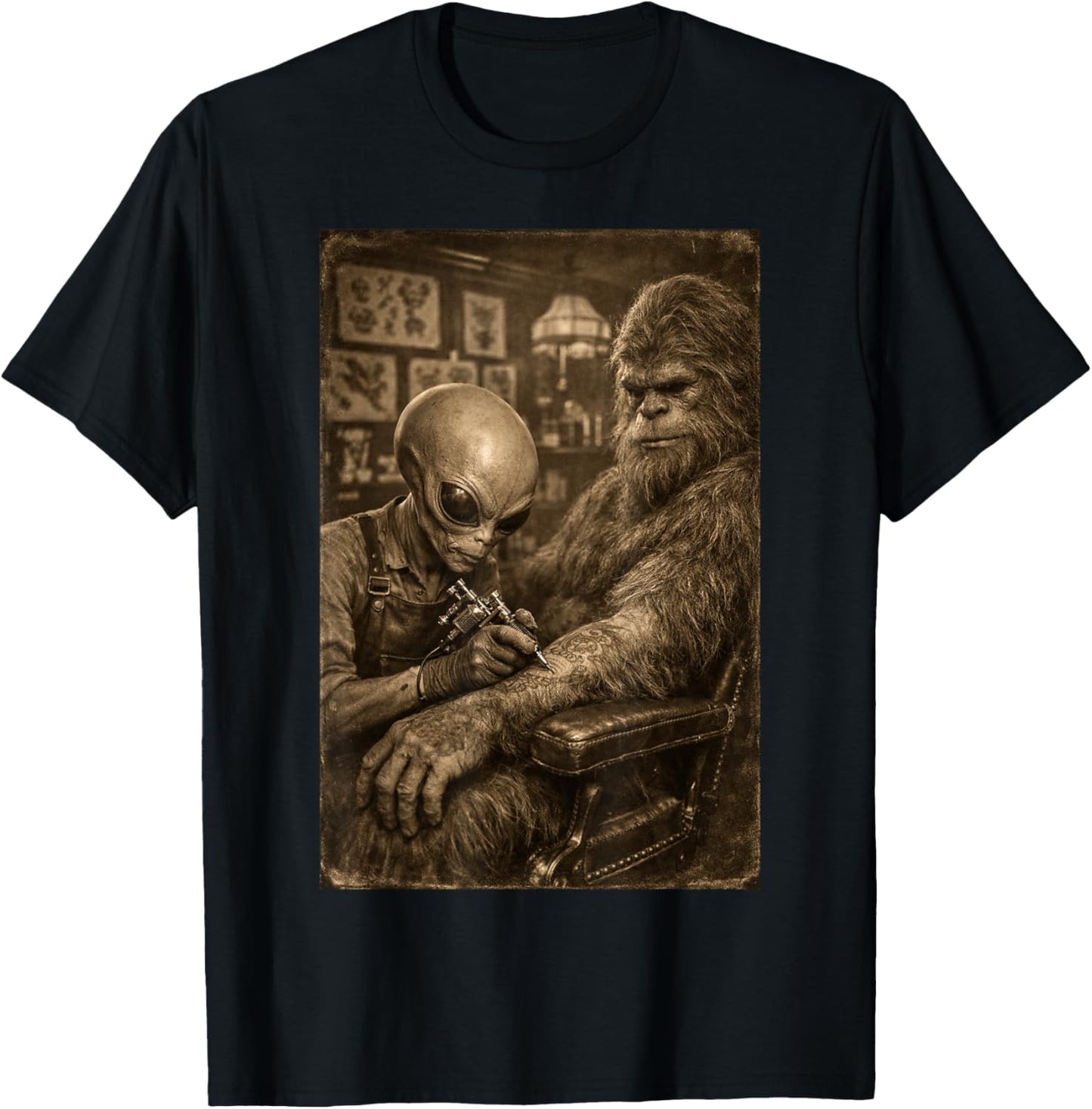 Alien Tattooing Bigfoot. Funny Cryptid UFO Sasquatch Lover T-Shirt - T-Shirt | Black